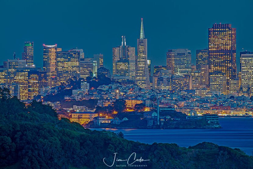 This is a night view of the San Francisco Skyline with Angel island and Alcatraz in the foreground and midground, as seen from Tiburon, California.
