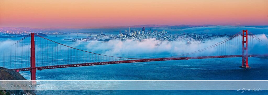 A view of San Francisco Bay with the Golden Gate Bridge in the foreground and the City of San Francisco in the background.