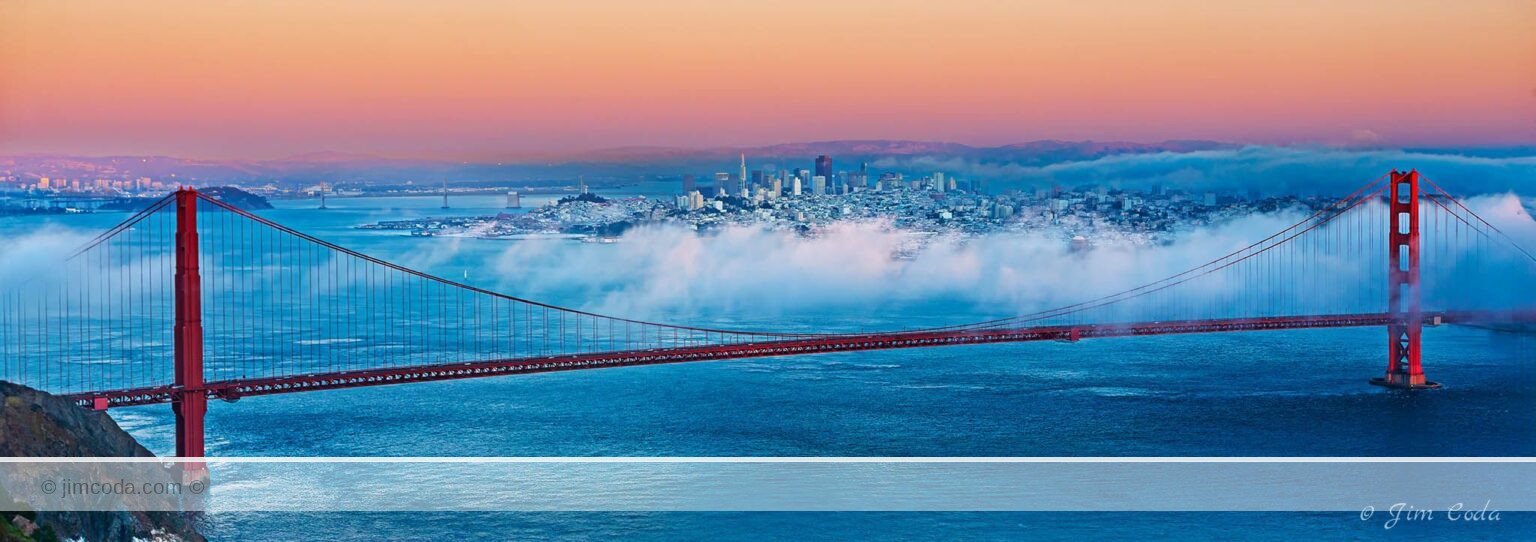 A view of San Francisco Bay with the Golden Gate Bridge in the foreground and the City of San Francisco in the background.