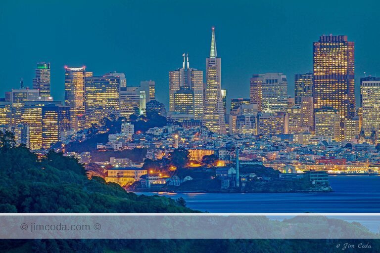 This is a night-time view of the San Francisco skyline with Angel Island and Alcatraz in the foreground. This photo was taken from Marin County, California.