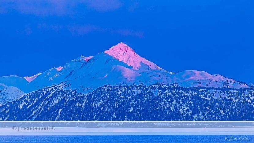 Photo of a mountain at dawn from Homer, Alaska.